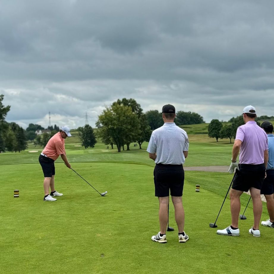 men playing golf together